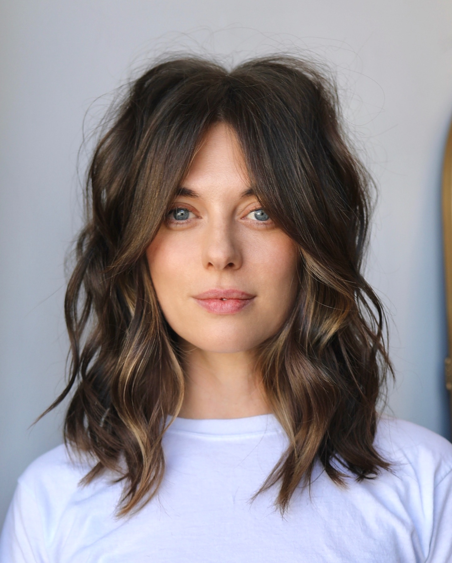 14. Dimensional Brunette Shag with Curtain Bangs - Medium-Length Hairstyle Ideas for Women