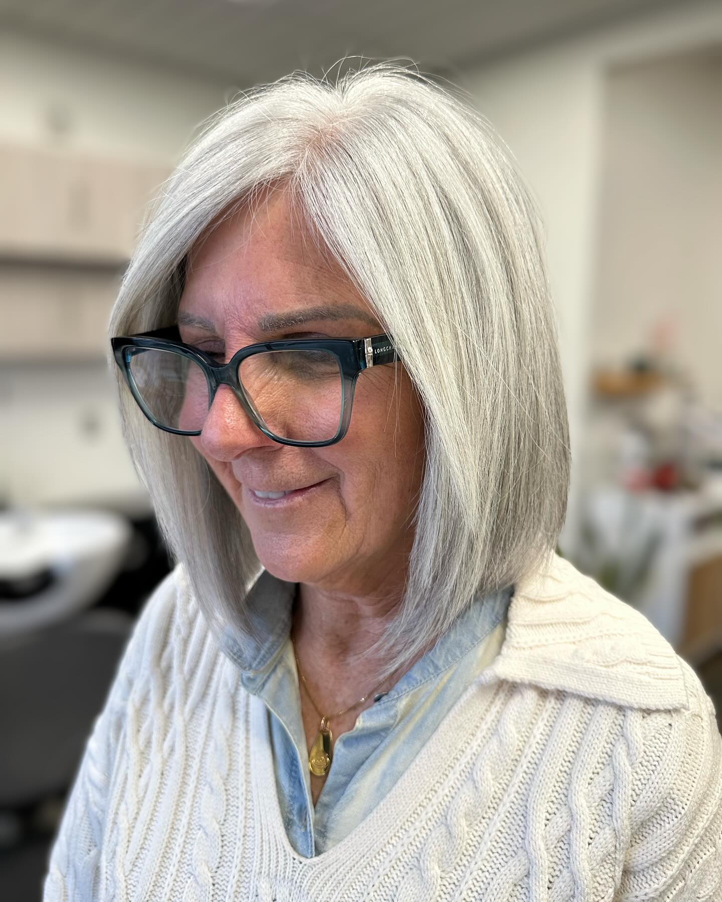 10. Icy Silver Bob with Sleek Layers - Medium-Length Hairstyle Ideas for Women