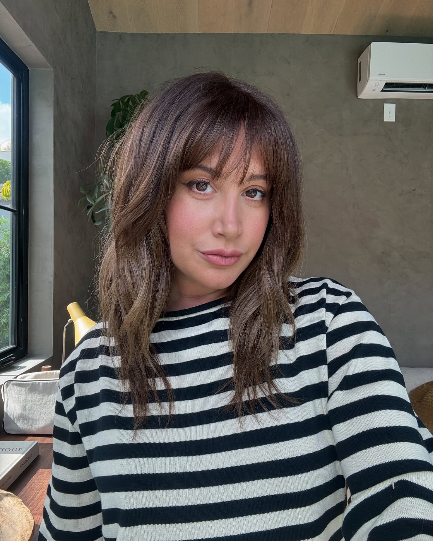 7. Ash Bronde Layers with Curtain Bangs - Medium-Length Hairstyle Ideas for Women