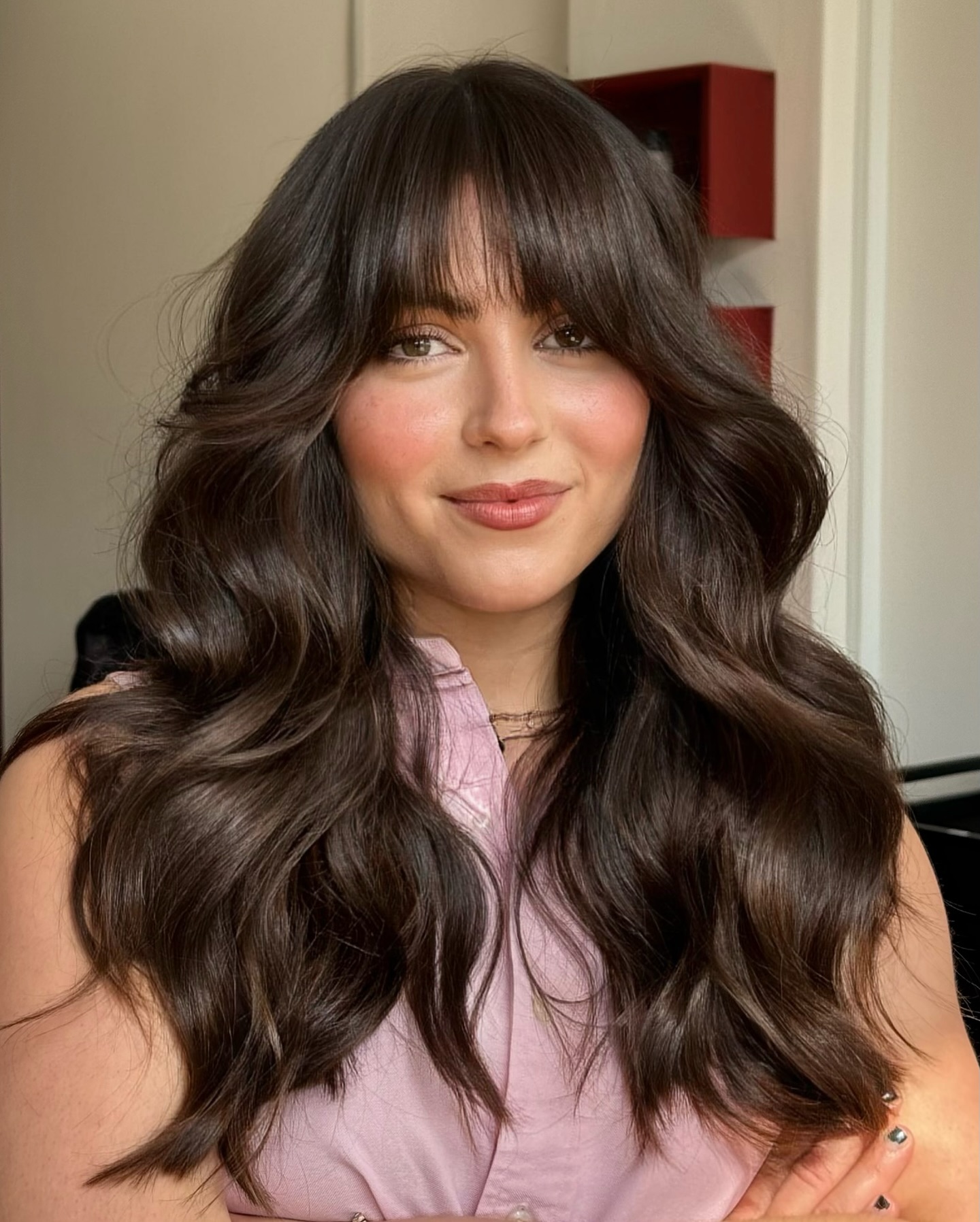 6. Glossy Chestnut Waves with Blunt Bangs - Medium-Length Hairstyle Ideas for Women