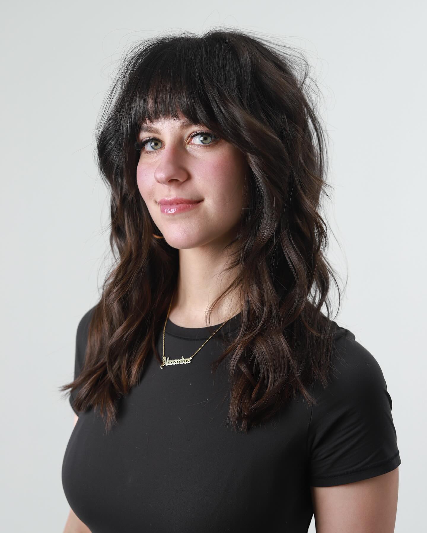 2. Textured Espresso Waves with Rounded Bangs - Medium-Length Hairstyle Ideas for Women