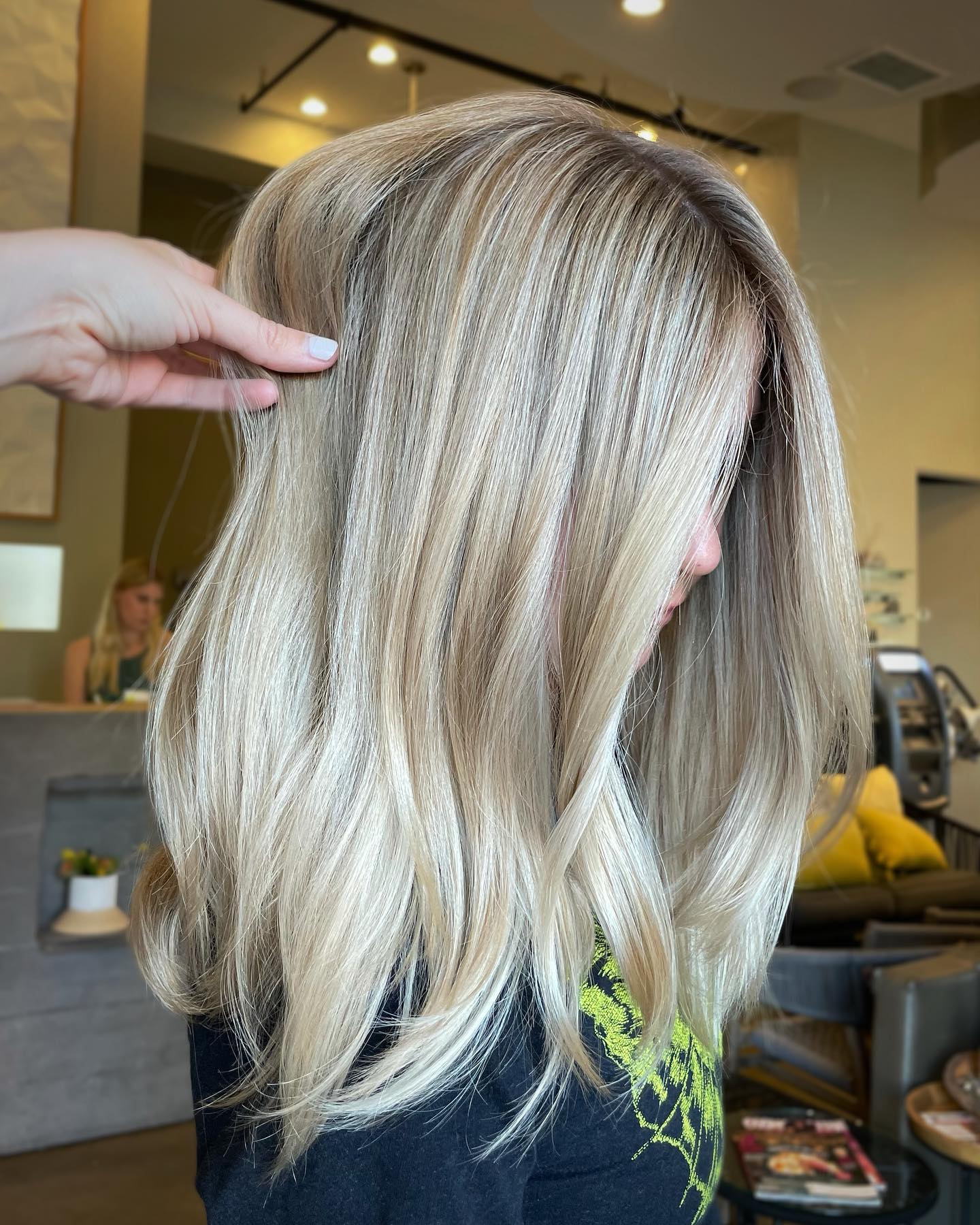 24. Icy Champagne Layers with Glossy Finish - Medium-Length Hairstyle Ideas for Women