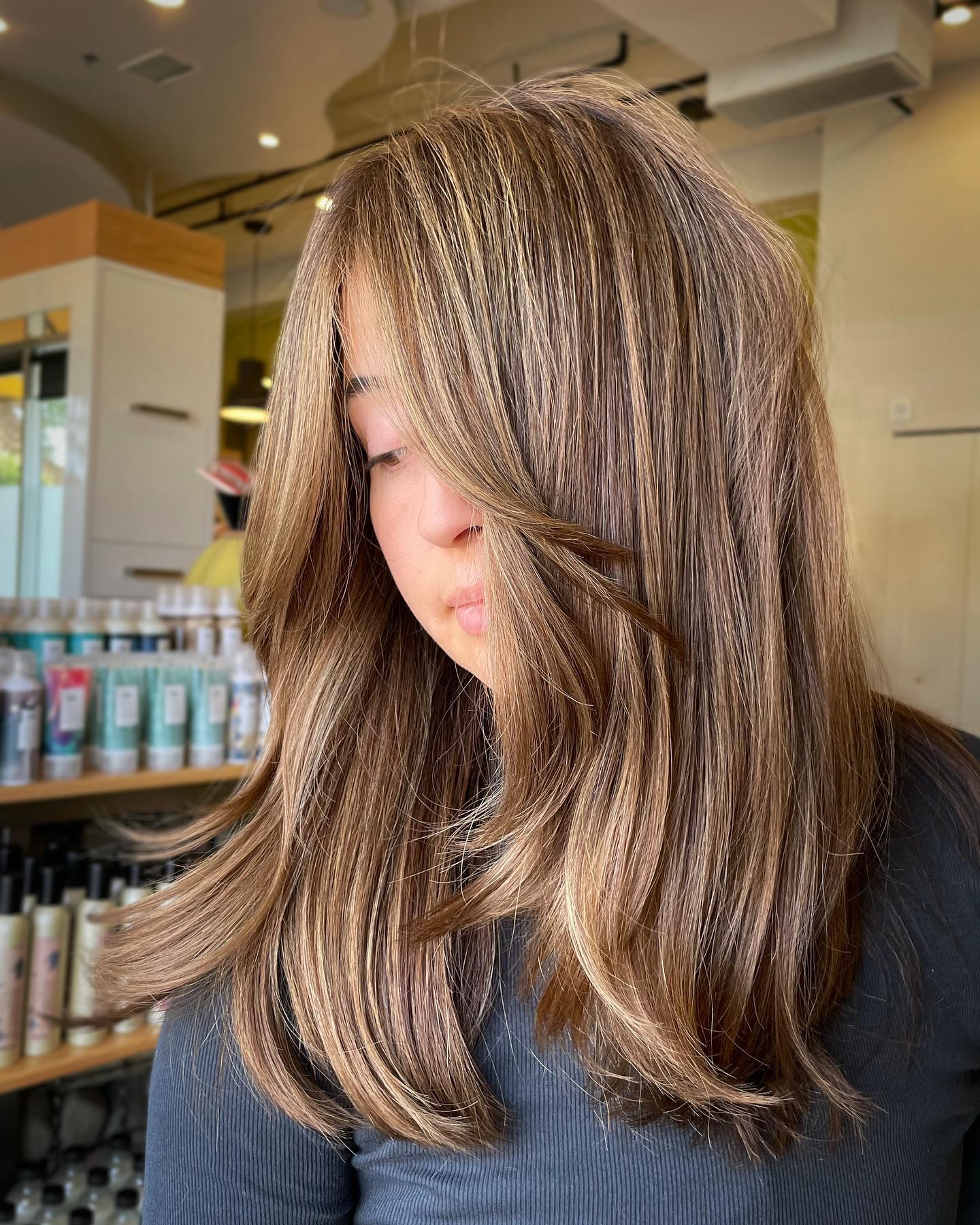 21. Golden Brunette Layers with Soft Face Frame - Medium-Length Hairstyle Ideas for Women