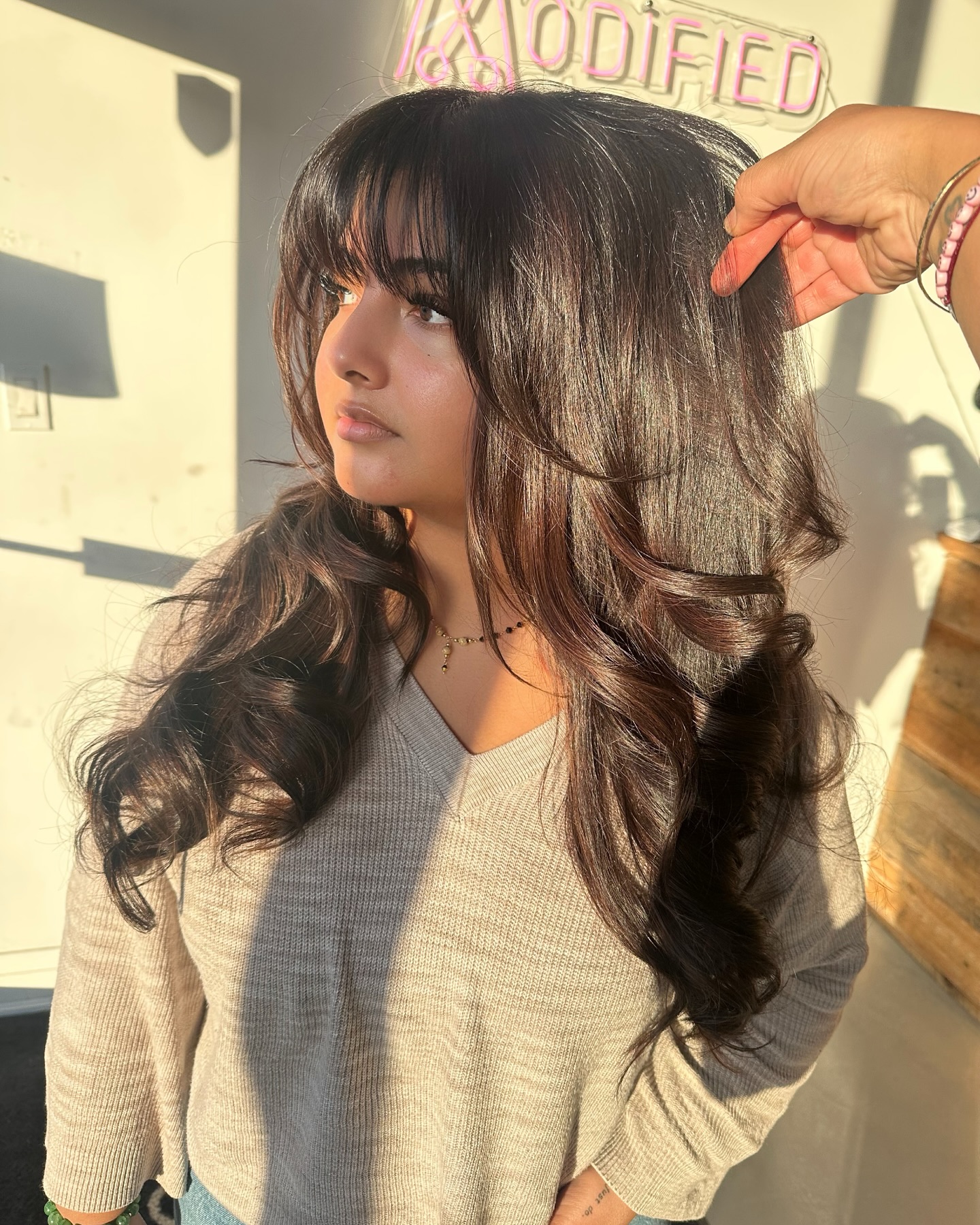 15. Glossy Cocoa Waves with Full Fringe - Long Hairstyle Ideas for Women