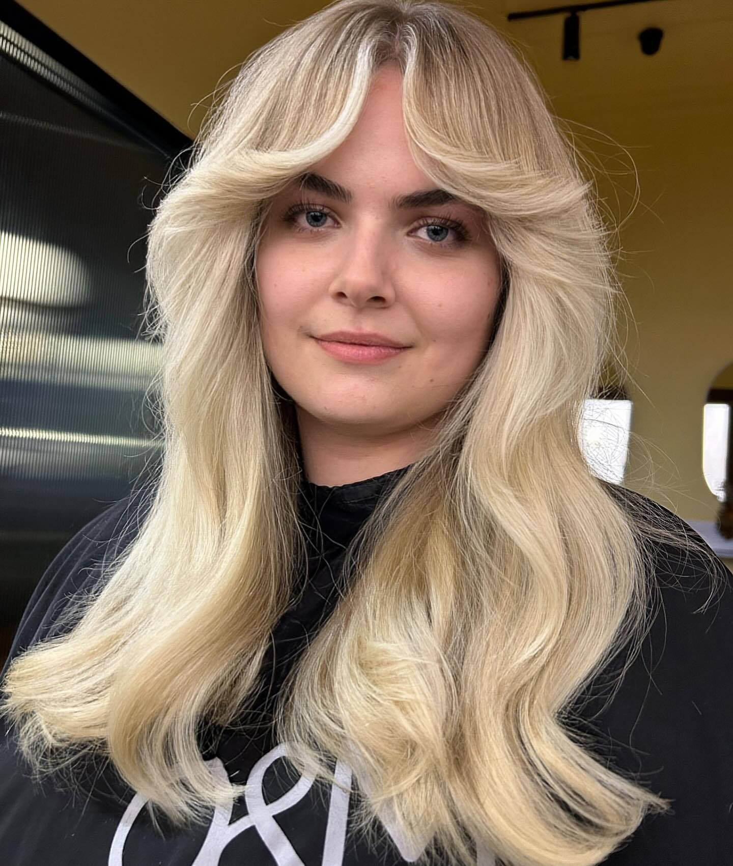 14. Platinum Layers with Voluminous Curtain Bangs - Long Hairstyle Ideas for Women