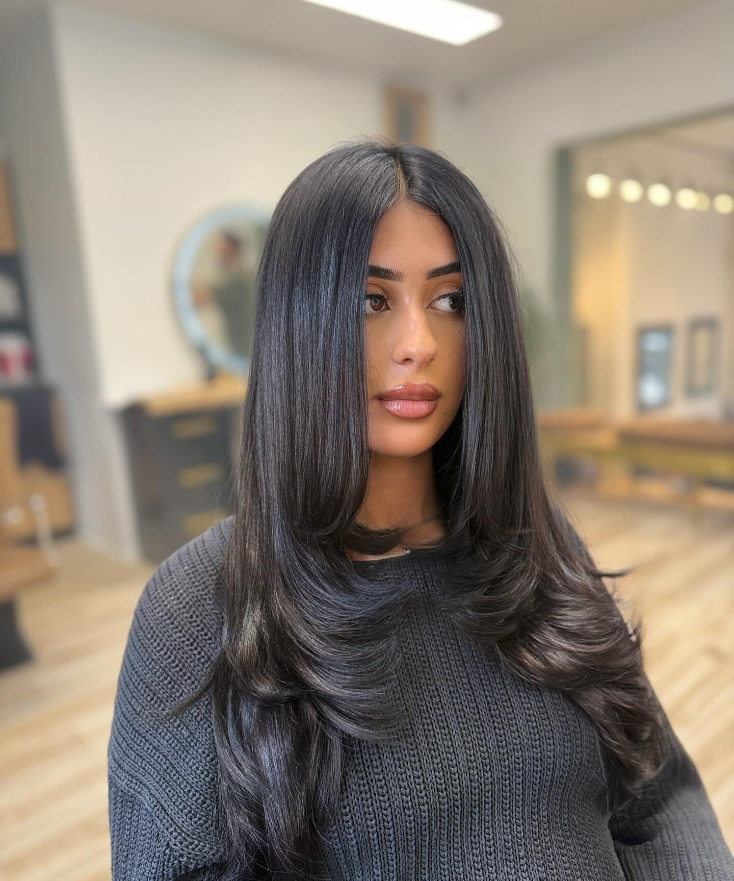 21. Jet Black Sleek Layers with Middle Part - Long Hairstyle Ideas for Women