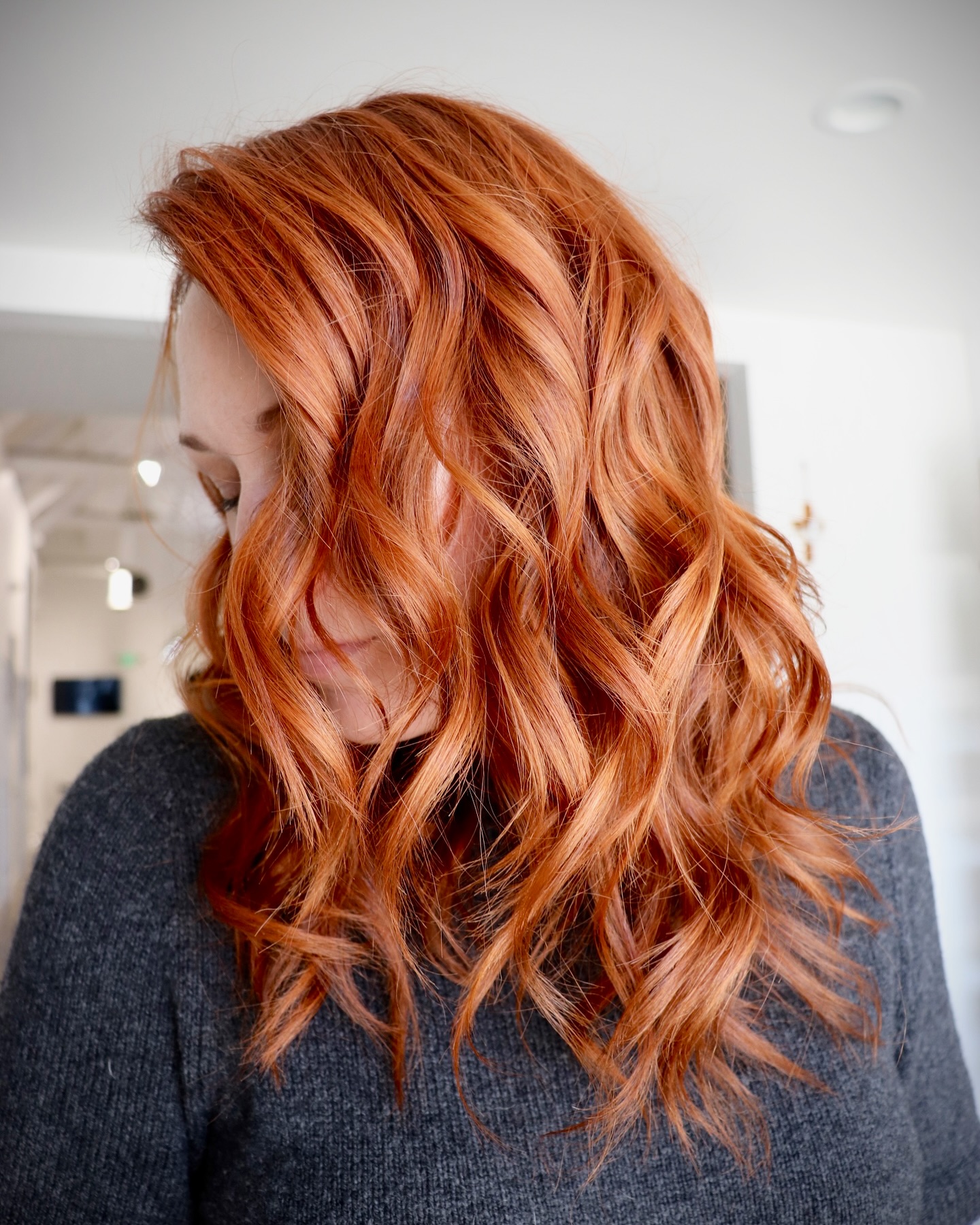 15. Bright Apricot Copper with Bouncy Curls - Copper Hair Color Ideas for Women