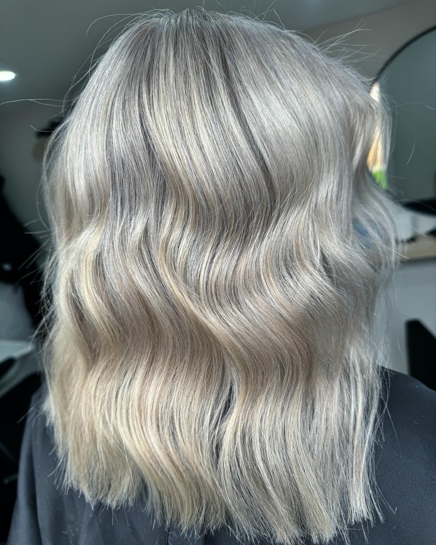 3. Smoky Ash Blonde Bob Waves - Ash Blonde Hair Color Ideas for Women