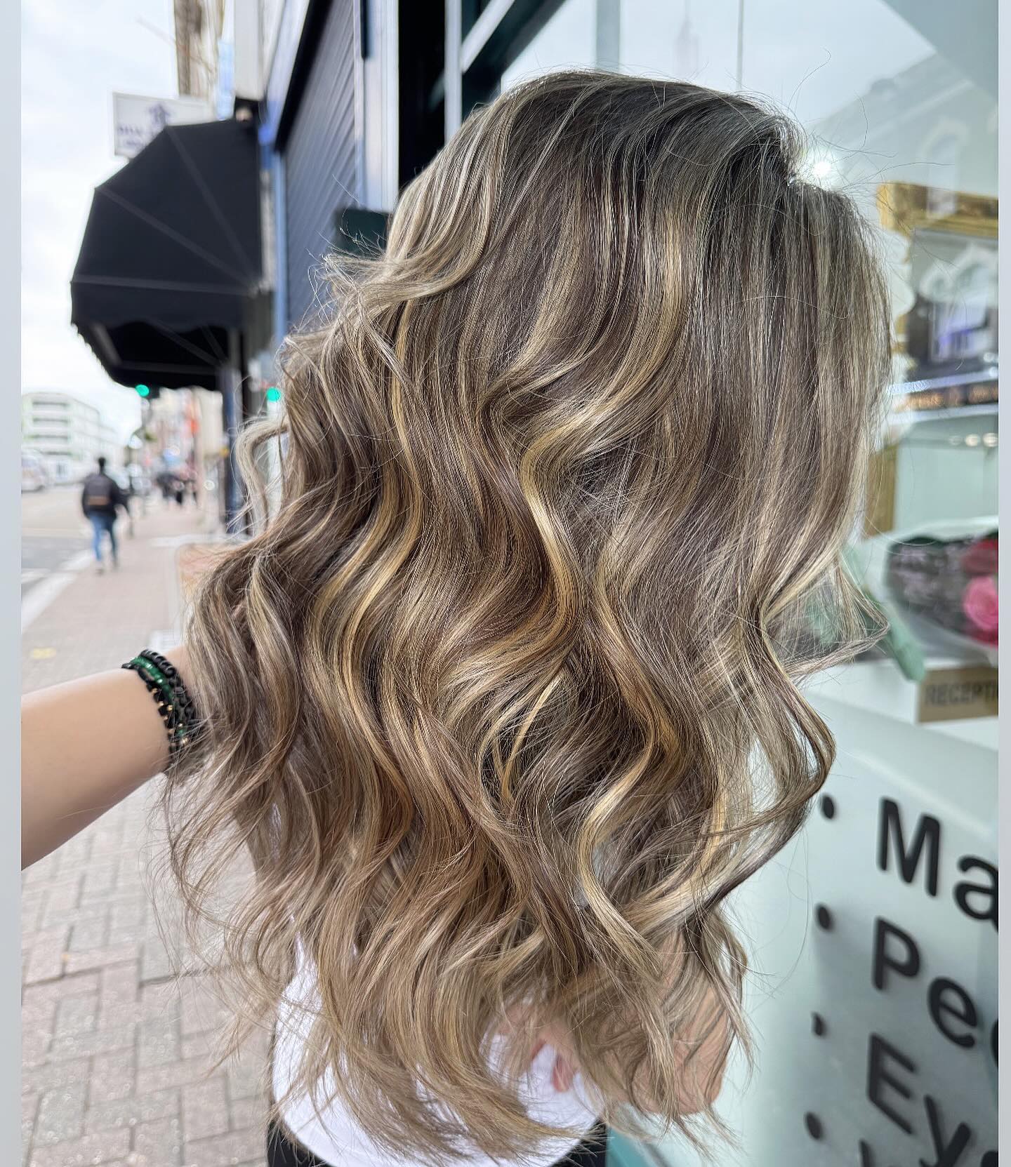3. Dimensional Wavy Blend with Cool Blonde Highlights - Light Brown Hair Color Ideas for Women