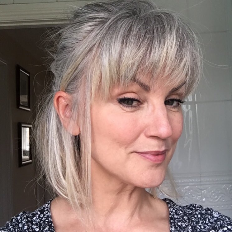 17. Casual Silver Ponytail - Hairstyles/Haircuts for Older Women